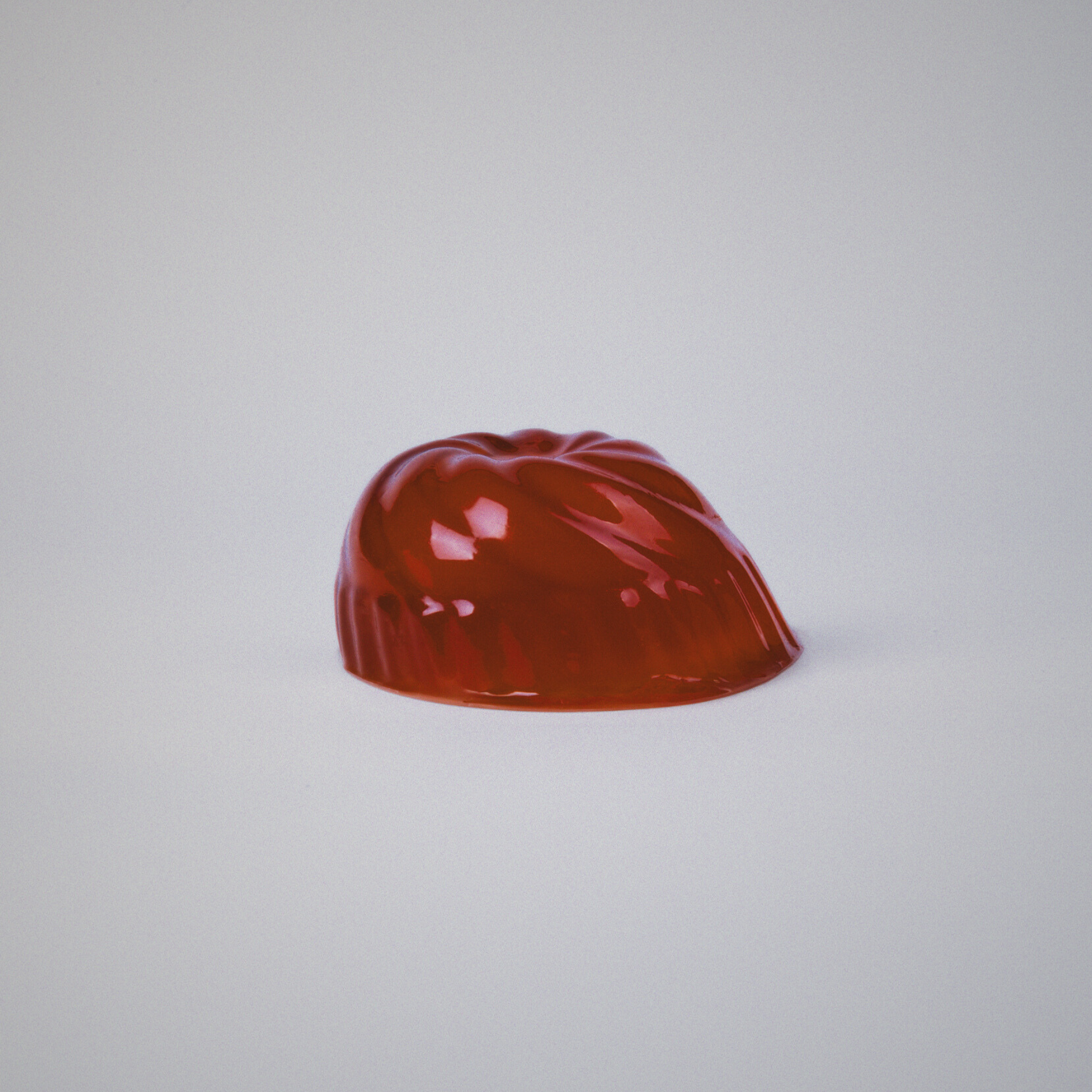 Red gelatin on a light gray background