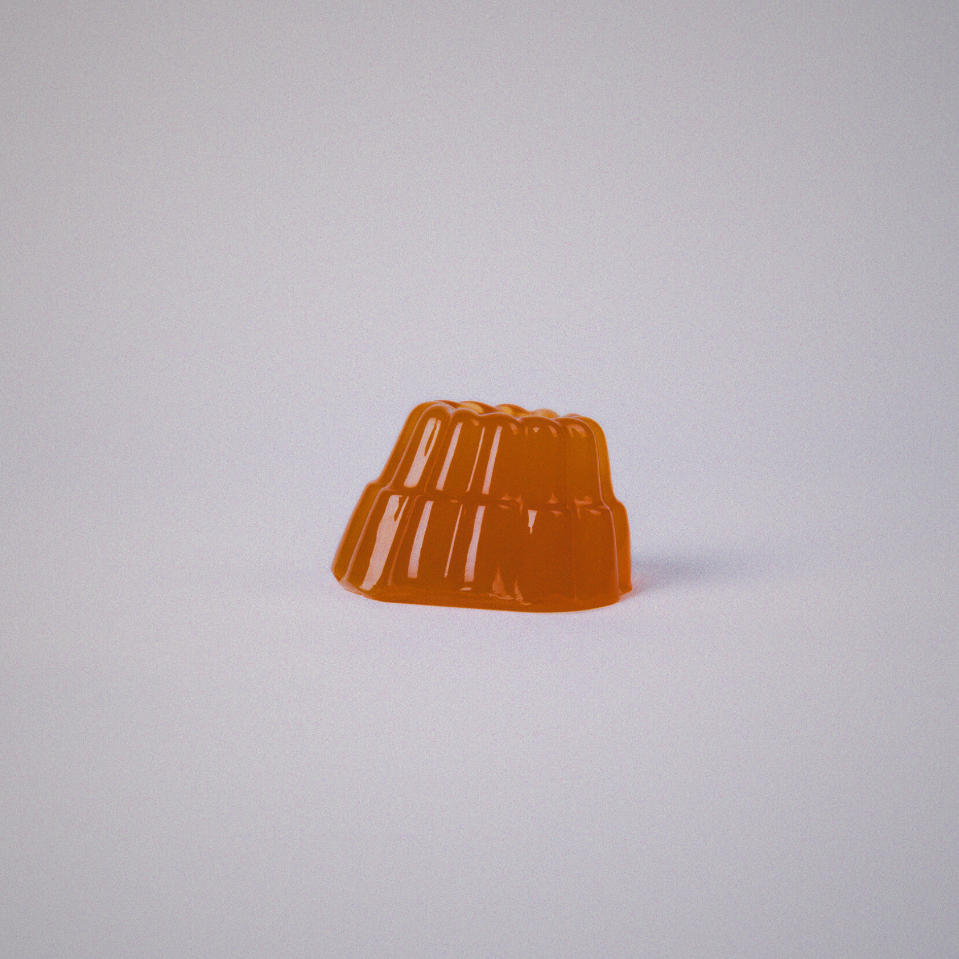 Orange gelatin on a light gray background